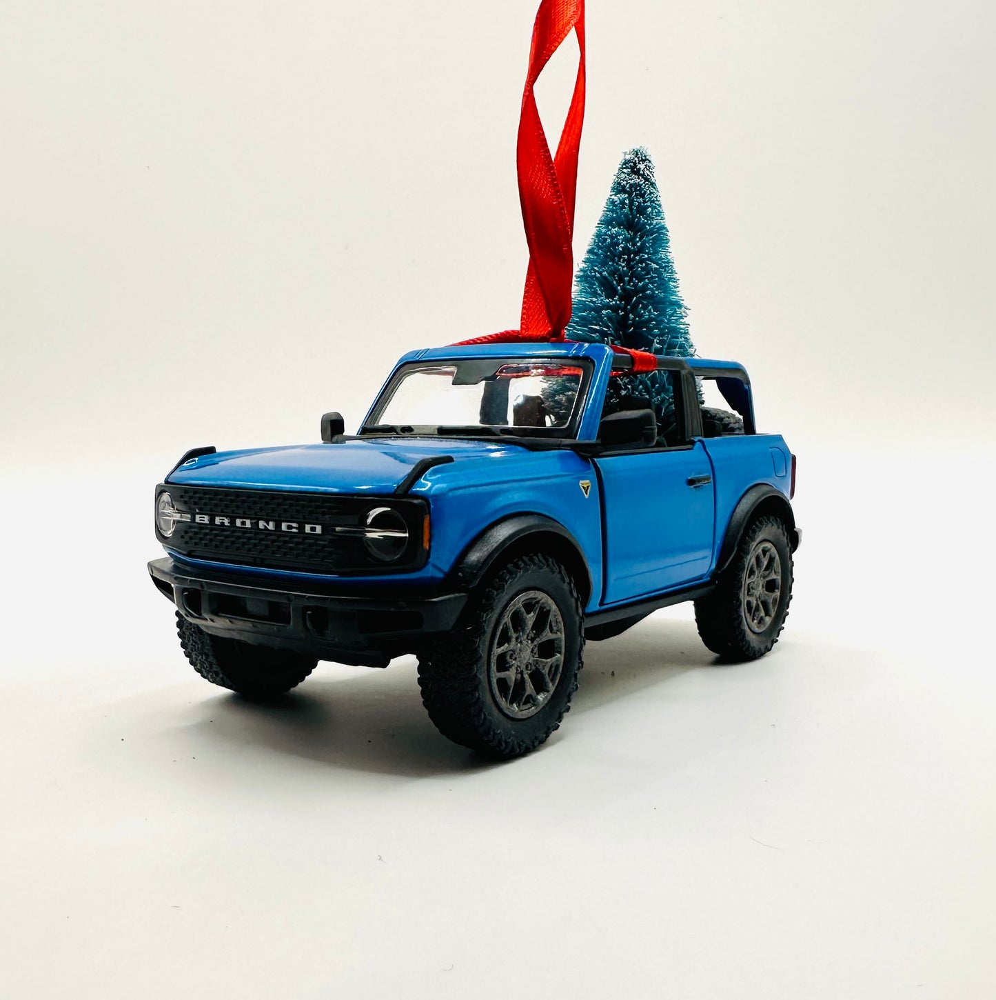 Blue Topless Ford Bronco Holiday Ornament with Tree