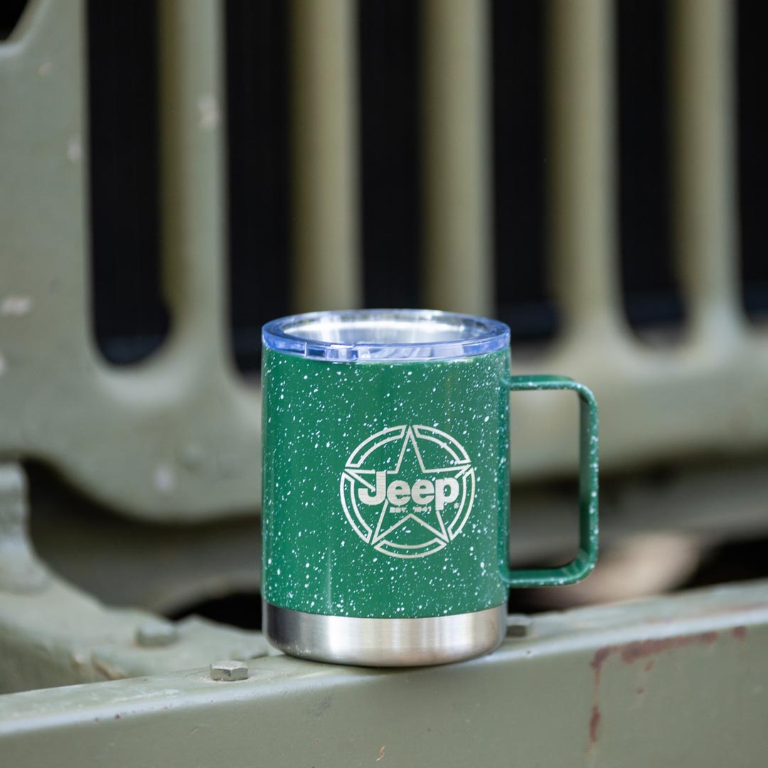 Green Coffee mug 10 oz on the front bumper of a Jeep