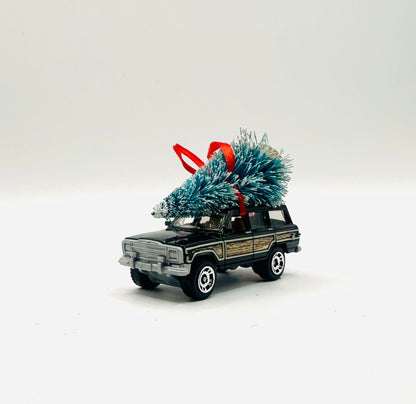Jeep Wagoneer Green diecast toy with a tree ornament on a white background