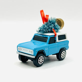 Light blue vintage Ford Bronco holiday ornament - angle view