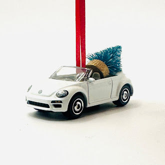 Angled front side of convertible beetle bug with ribbon and tree -offroad collectibles