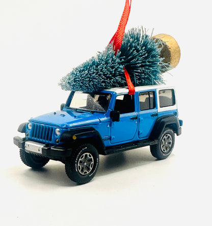 Chief Blue Jeep Wrangler JK Unlimited 4-door diecast ornament with Christmas tree and red ribbon - side view