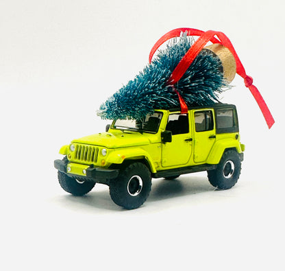 Vibrant hyper green Jeep Wrangler JK Unlimited ornament with festive Christmas tree and red ribbon - angle view