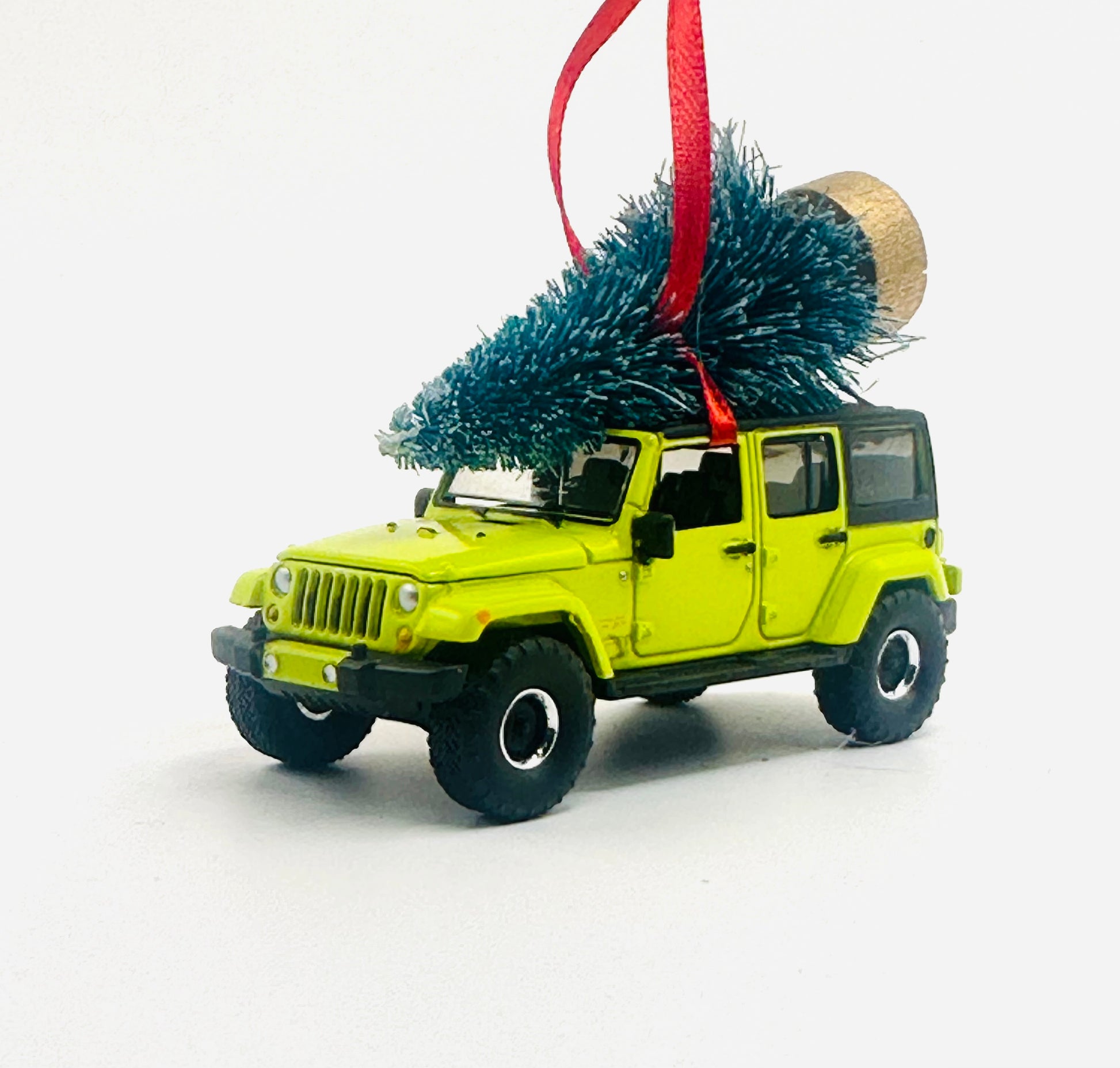 Hyper Green Jeep Wrangler JK Unlimited 4-door diecast ornament with Christmas tree and red ribbon - side view