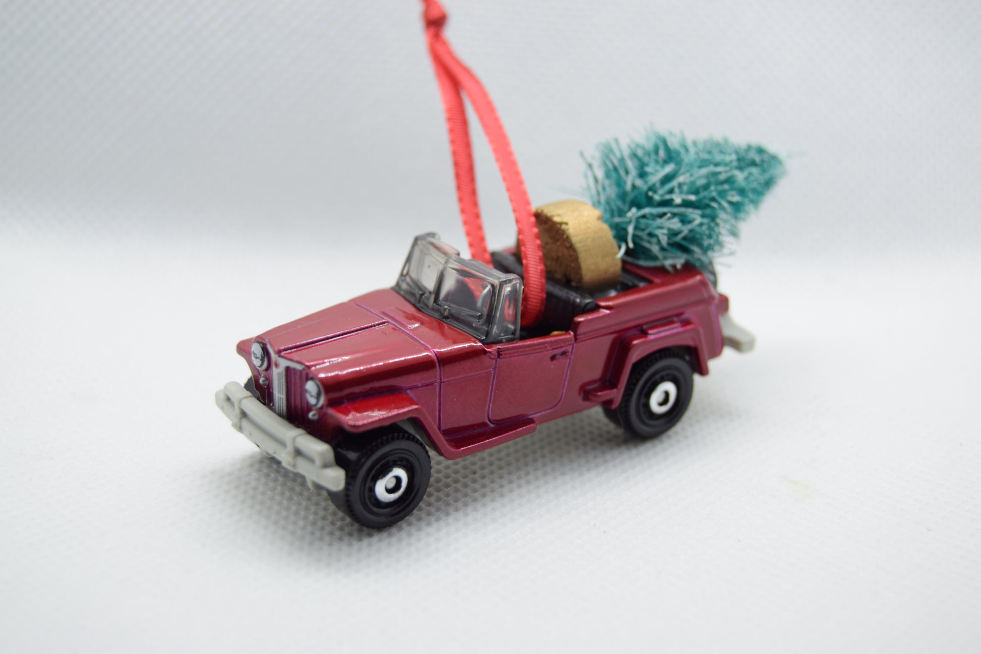 Maroon Jeepster Commando convertible ornament with Christmas tree