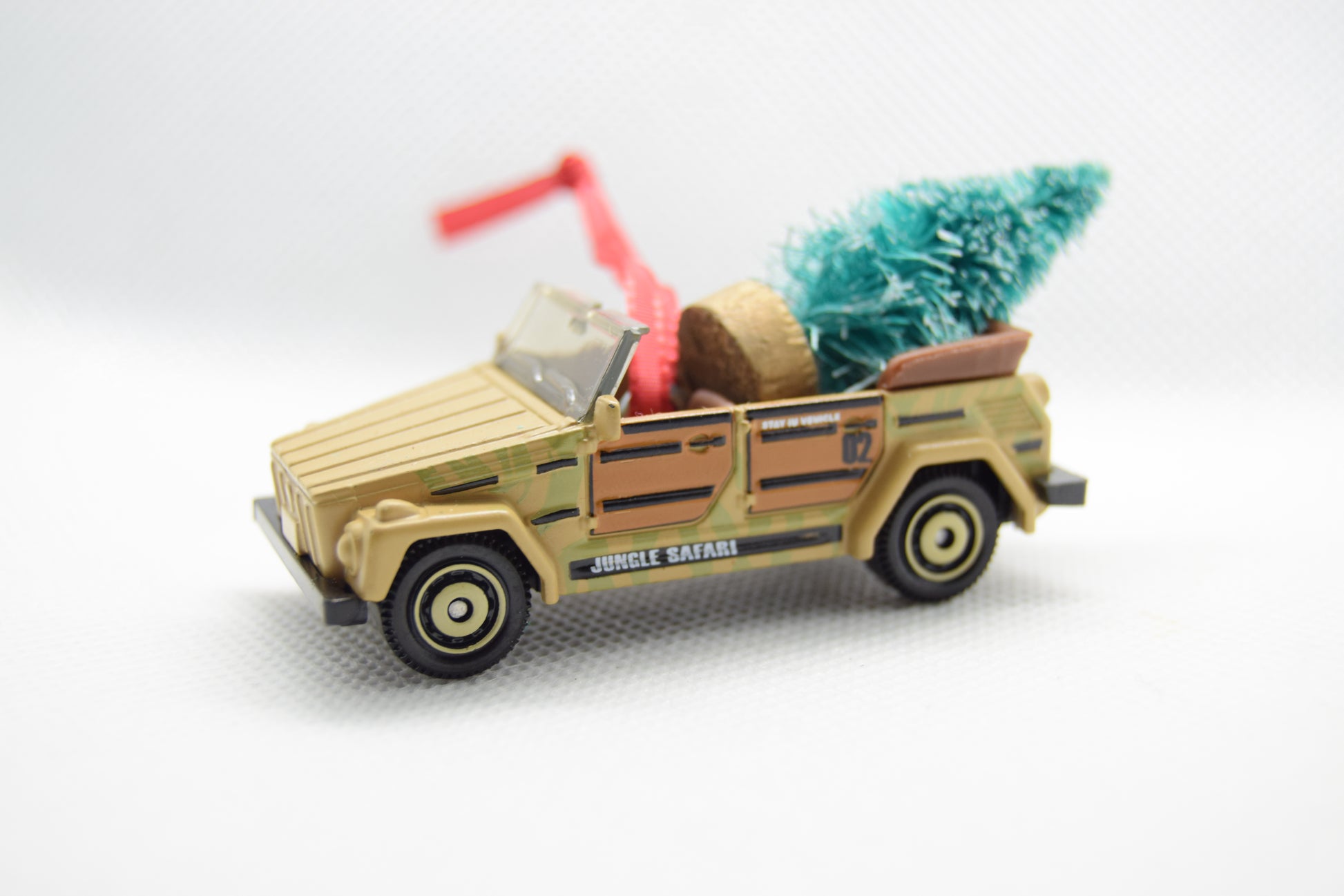 Tan VW Thing Jungle Safari ornament with Christmas tree and red ribbon